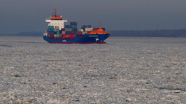 Container ship crashing through ice