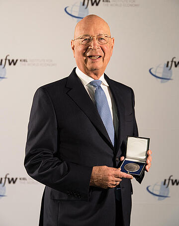 Klaus Schwab showing his medal