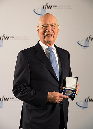 Klaus Schwab showing his medal