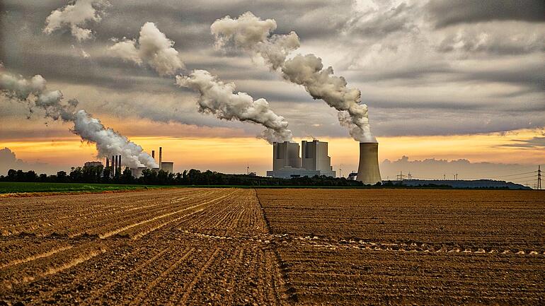 Smoke rising from different power and industrial plants