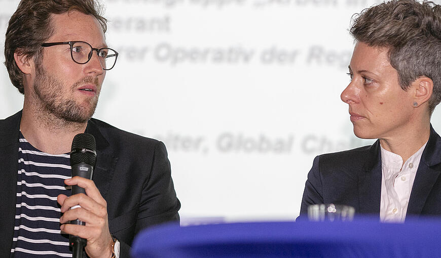 Two speakers on stage