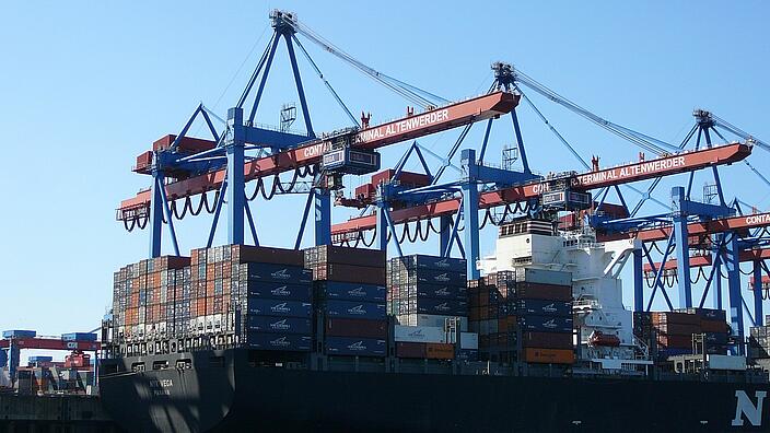 Cargo ship in the harbor of Hamburg Altenwerder