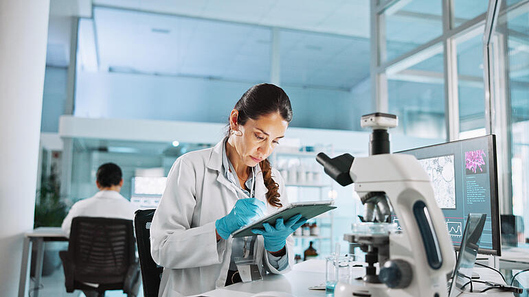 Scientist, woman and tablet with research for biology, innovation or medical notes analysis