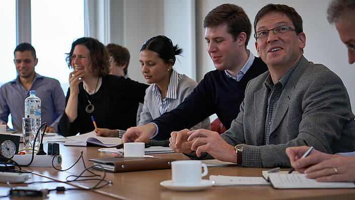 KCG Workshop Kick-off people listening to insivible speaker