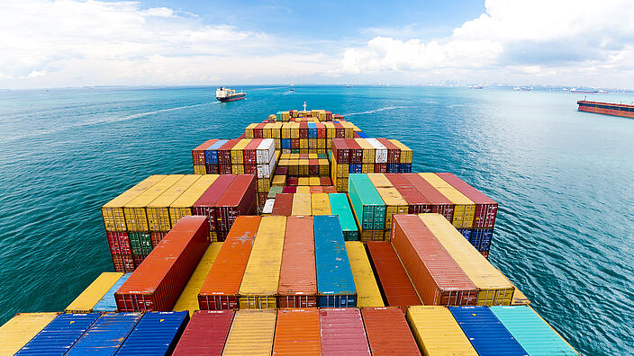 View over cargo ship deck with containers 