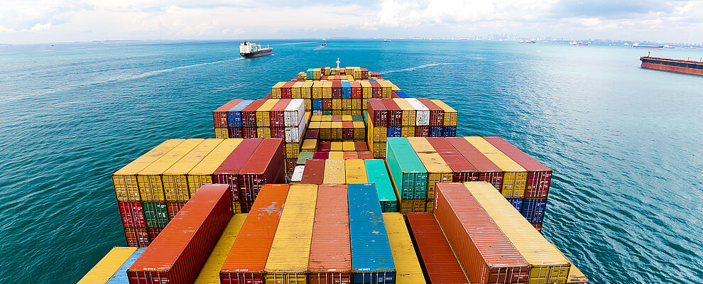 View over cargo ship deck with containers 