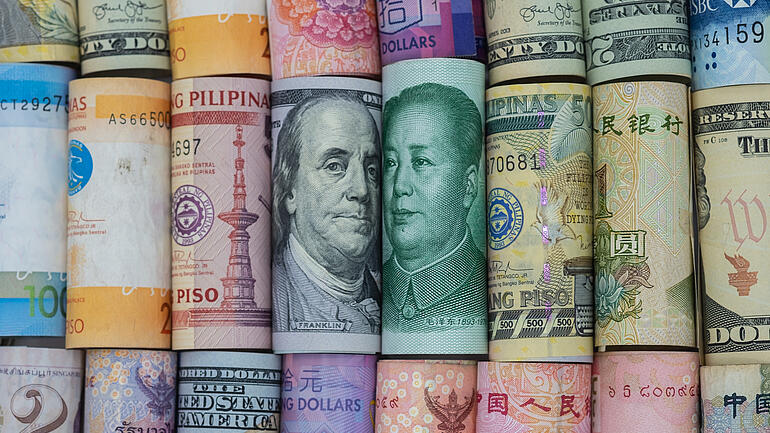 Rolls of bank notes in different currencies