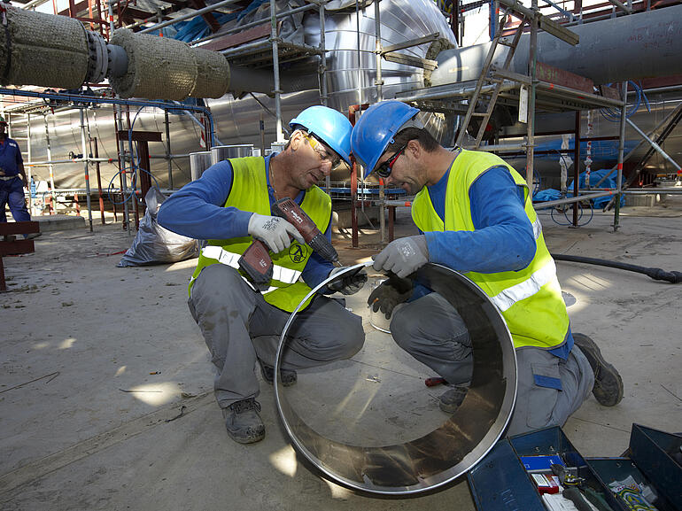 Men working on a tube