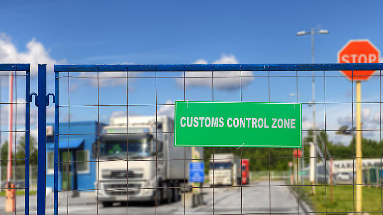 Trucks pass through the checkpoint of the customs logistics terminal