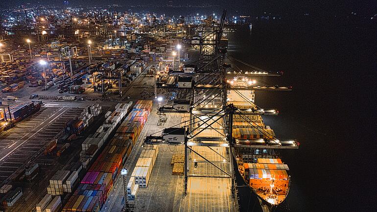 Cargo ship in port at night