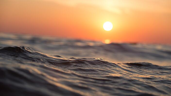 Close-up of the ocean at sunset