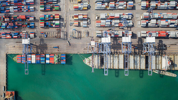 Container box loading by crane, Vessel boat in logistic Singapore port, transportation, delivery and business concept