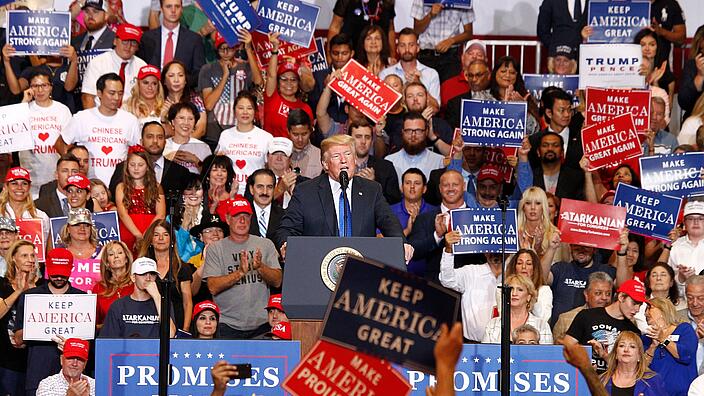 Donald Trump speaking at an election campaign event