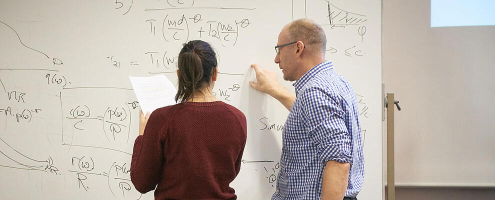 Discussions in front of the blackboard